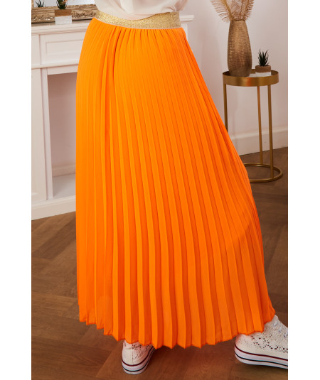 long orange pleated skirt